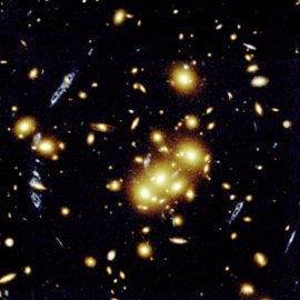 gravitational lens: caused by a galactic cluster [Credit: Photo AURA/STScI/NASA/JPL (NASA photo # STScI-PRC96-10)]